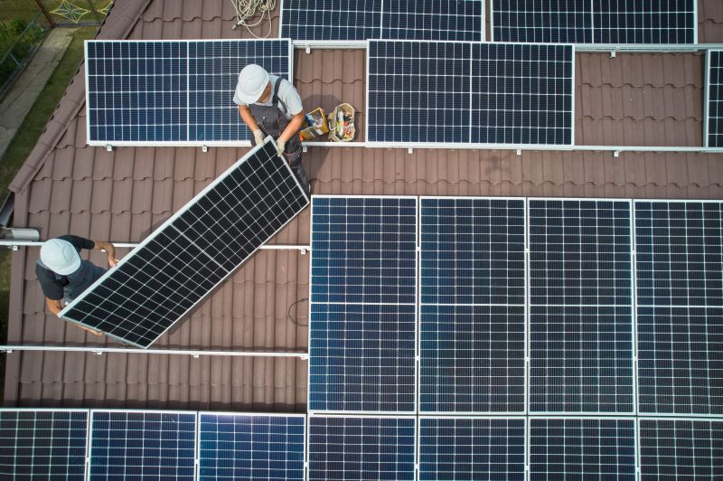Technician Mounting Solar Panels